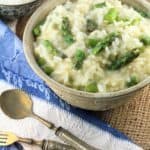 Lemony Asparagus Risotto in bowl with spoons next to it.