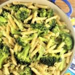 Pasta with broccoli in large skillet.