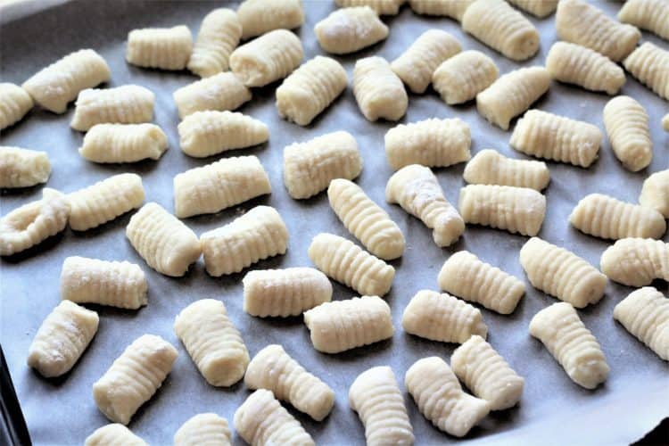 finished gnocchi on a baking sheet