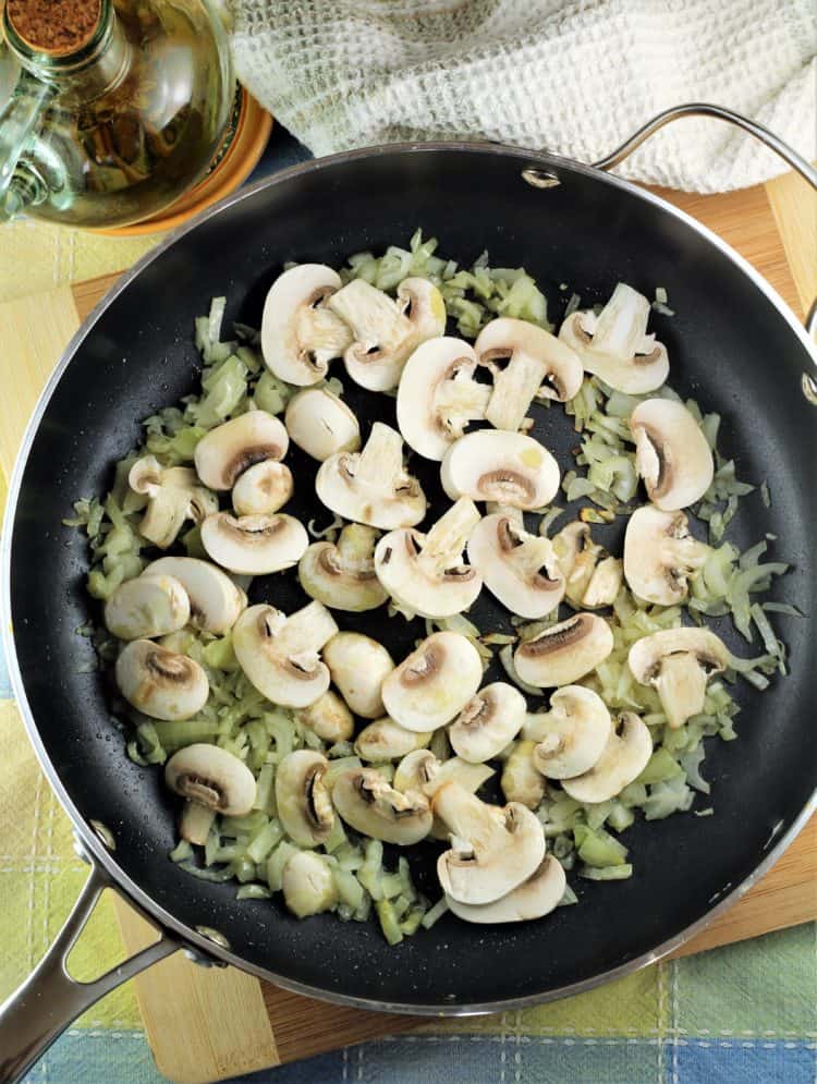 skillet with sauteing mushrooms and onions