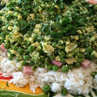 rice layered with peas, ham and cilantro