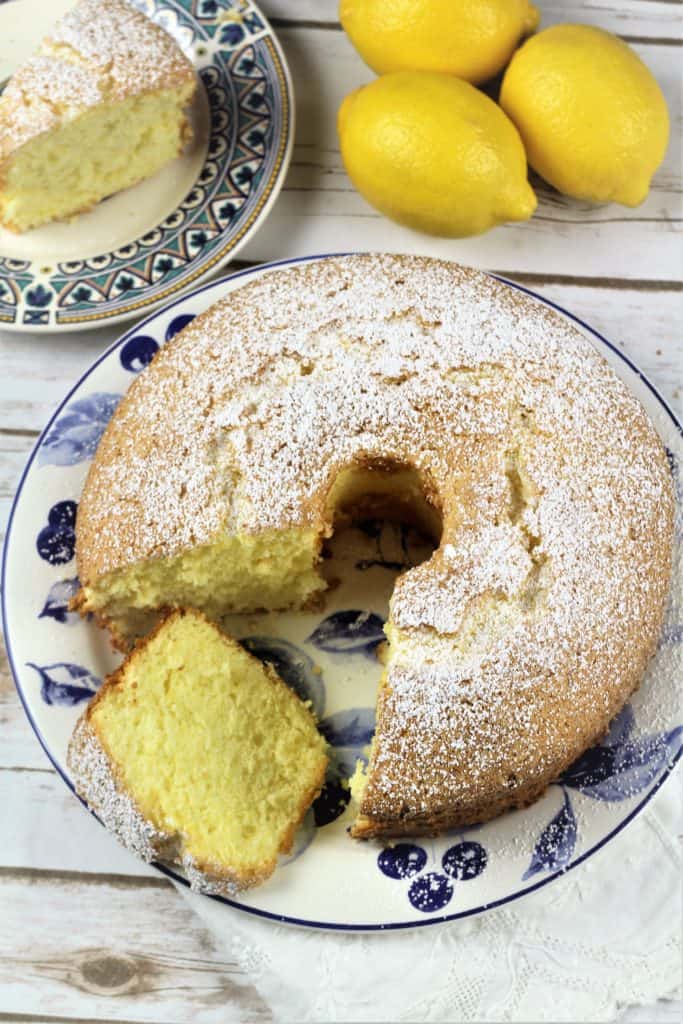 Overhead view of Nonna's Sponge Cake with one slice cut