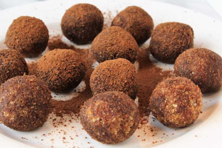 cocoa dusted date and nut truffles in a plate