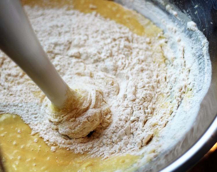 mixing flour, eggs and milk for crepes