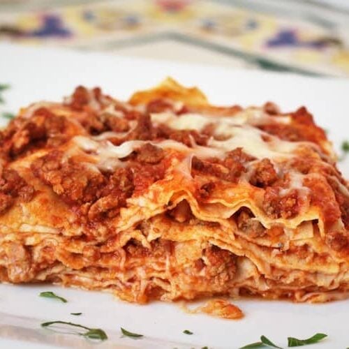 Crepe Lasagna on place topped with fresh parsley.