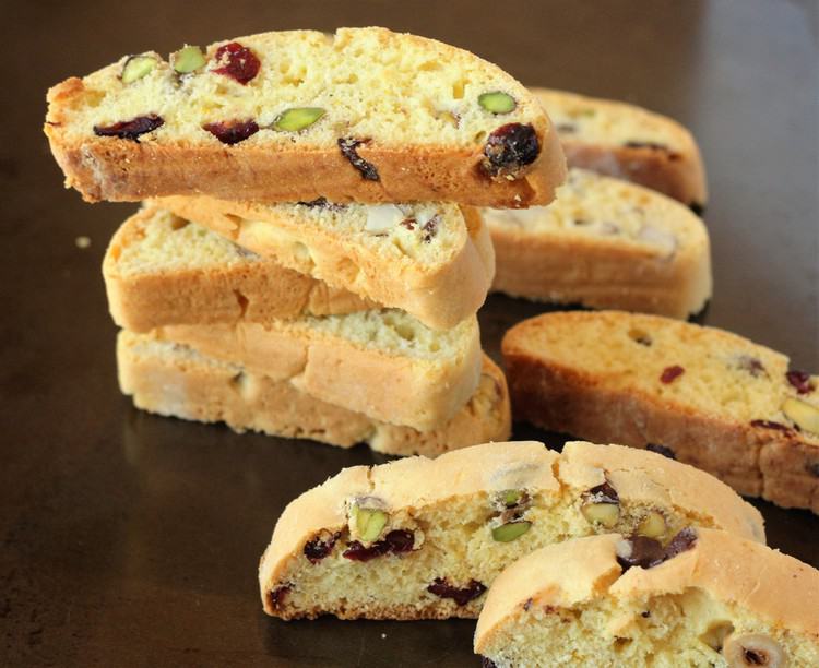 pistachio cranberry biscotti piled on top of one another