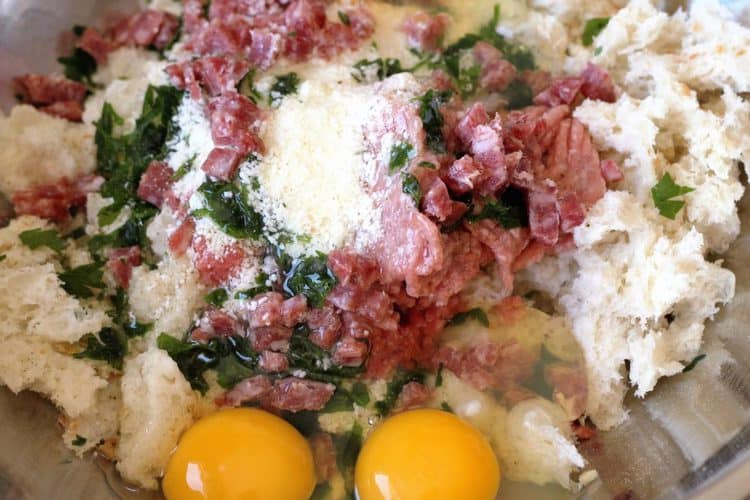 bread crumbs, ground meat, cheese, parsley and eggs in a bowl