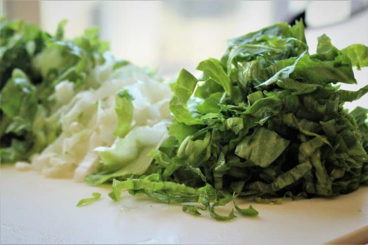 chopped escarole on a cutting board