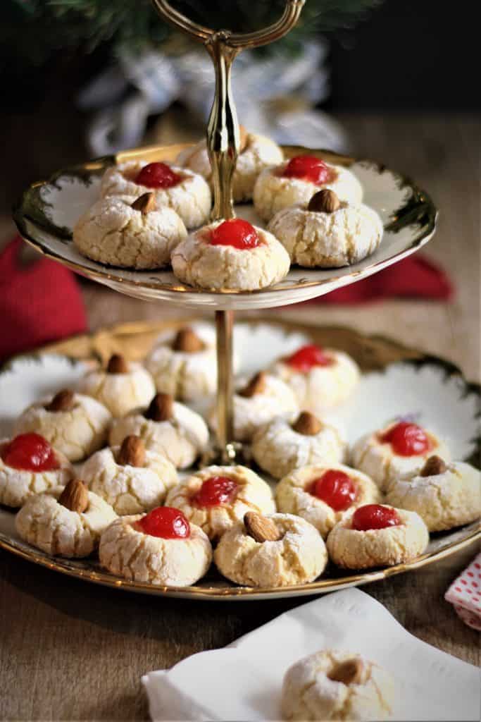 two tiered gold plate filled with amaretti cookies