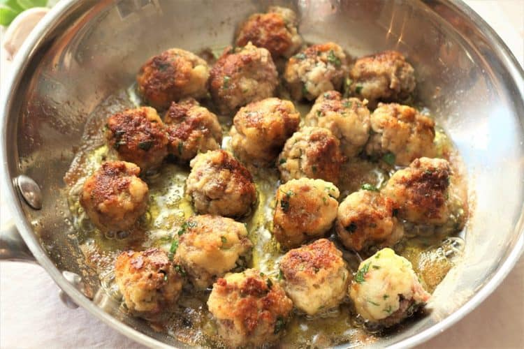 tiny meatballs browned in skillet with olive oil