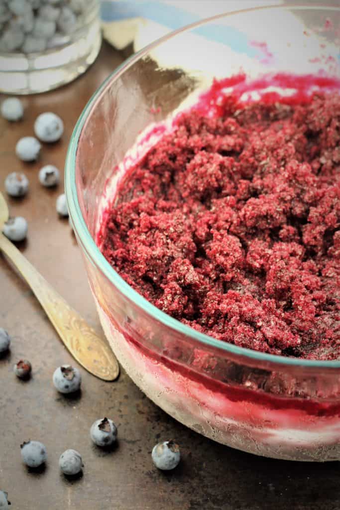 glass bowl filled with frozen blueberry granita mixture