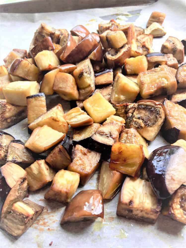 roasted cubed eggplant on baking sheet