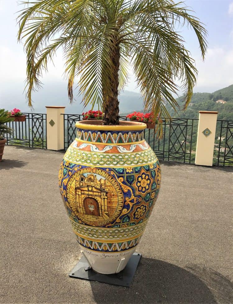 hand painted ceramic pot with palm tree in it