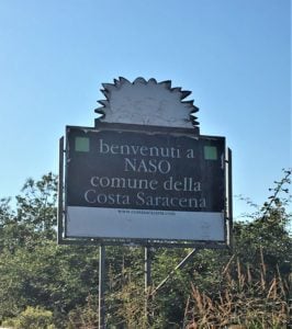 street sign announcing the town of Naso