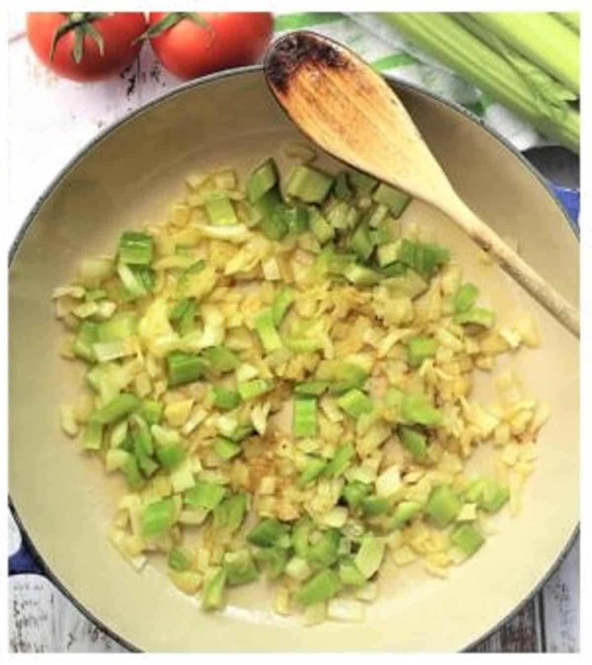 Sautéed onion and celery in skillet for caponata.