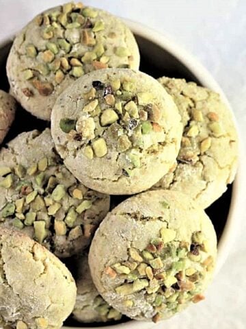 Pistachio amaretti cookies in bowl.