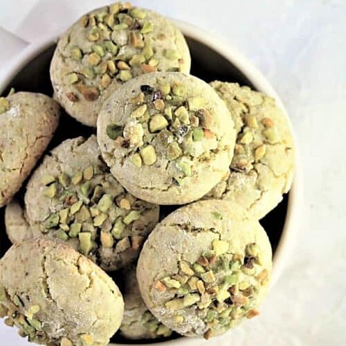 Pistachio amaretti cookies in bowl.