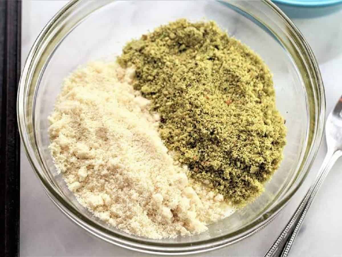 Pistachio flour and almond flour added to bowl with egg and sugar.
