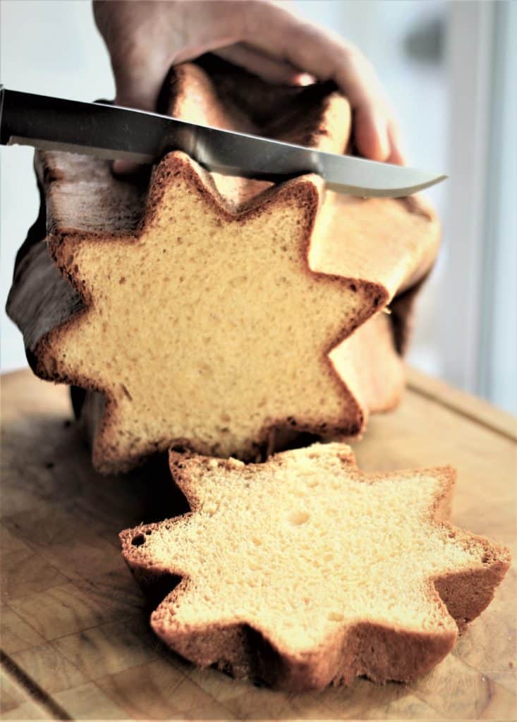 slicing star shaped Pandoro slices 