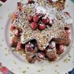Pandoro French Toast piled in Christmas tree fromation and dusted with powdered sugar