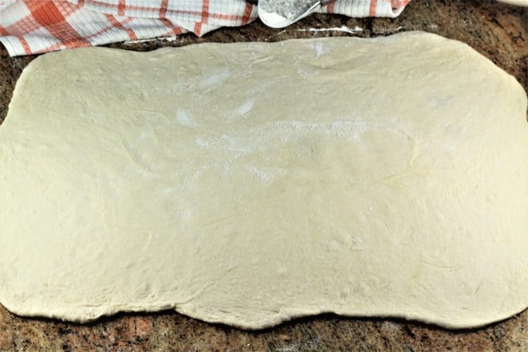 rolled out dough for Sicilian Sausage Bread (Bignolati)