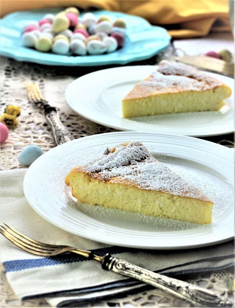 Sweet Ricotta Easter Calzone wedges on white plates and forks beside them