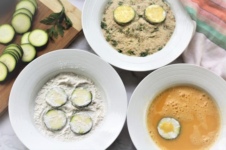 bowls with flour, eggs and breadcrumbs for dredging zucchini