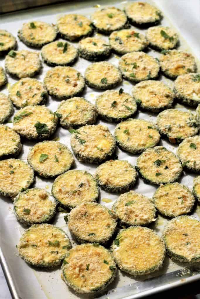 baking pan with prepared parmesan zucchini crisps ready for the oven