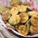 basket of Baked Zucchini Parmesan Crisps with forks on the side