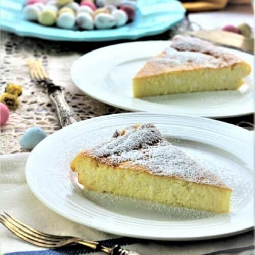 Slices of sweet ricotta Easter calzone on round plates with forks.