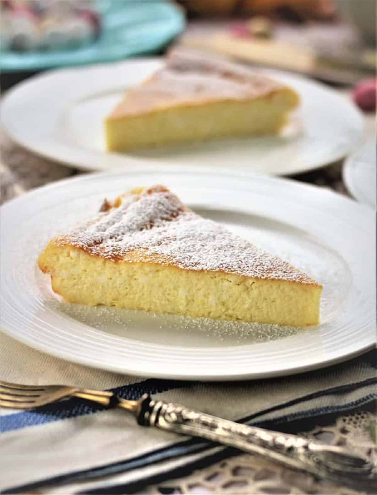 Slice of ricotta Easter calzone on plate with fork.