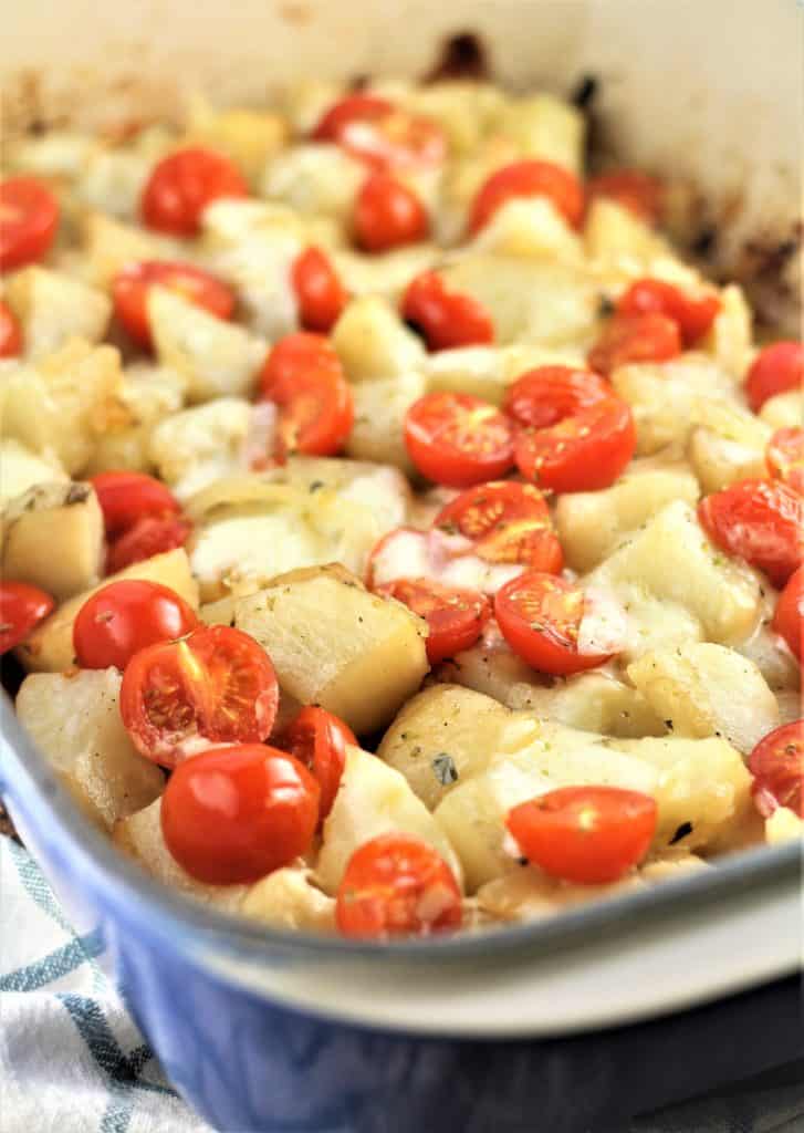 blue baking dish with Trapani style potatoes vastase