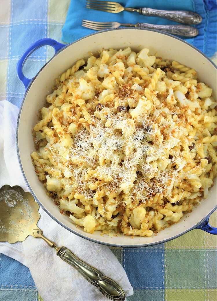 overhead view of pasta with cauliflower in blue pan