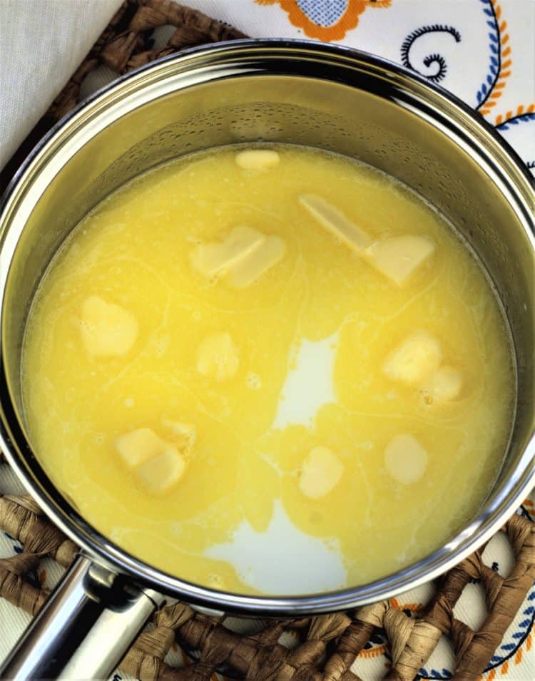 sauce pan with warm milk and melted butter