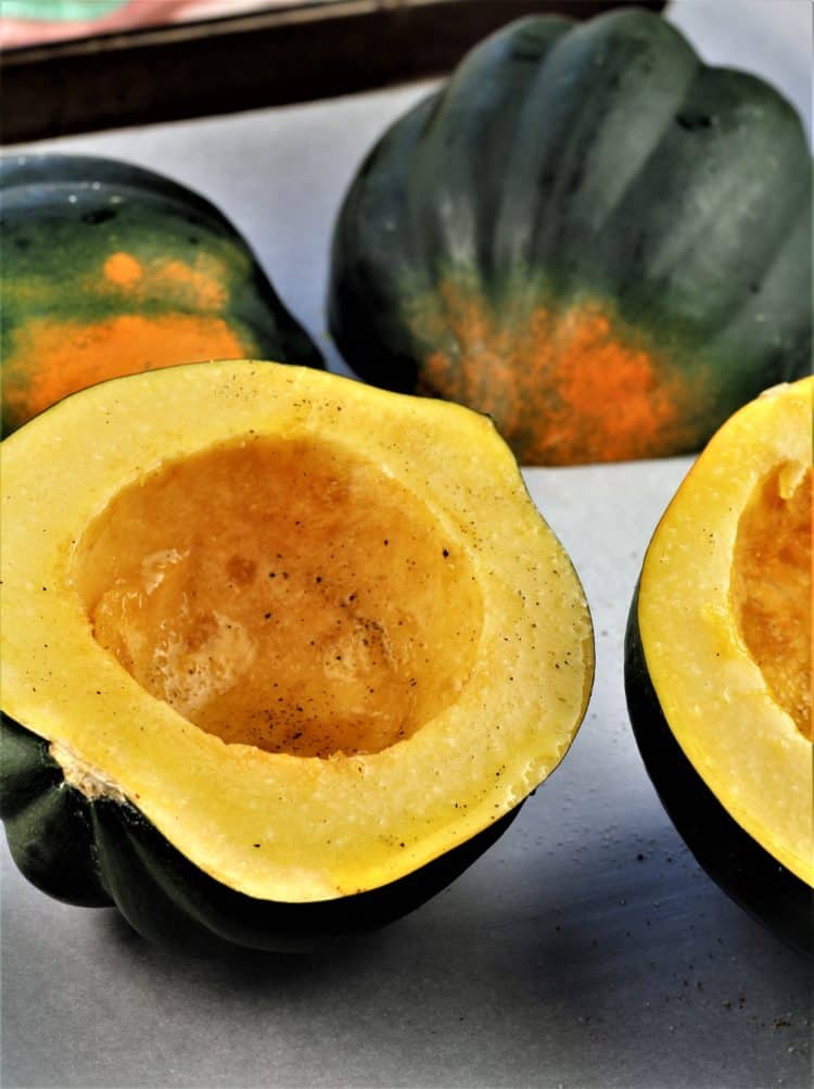 halved acorn squash drizzled with olive oil and salt and pepper