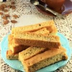 Sheet Pan Almond Biscotti on blue bowl with coffee cup