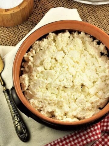 Homemade ricotta in earthenware bowl.