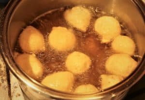 sauce pan with potato sfinci frying