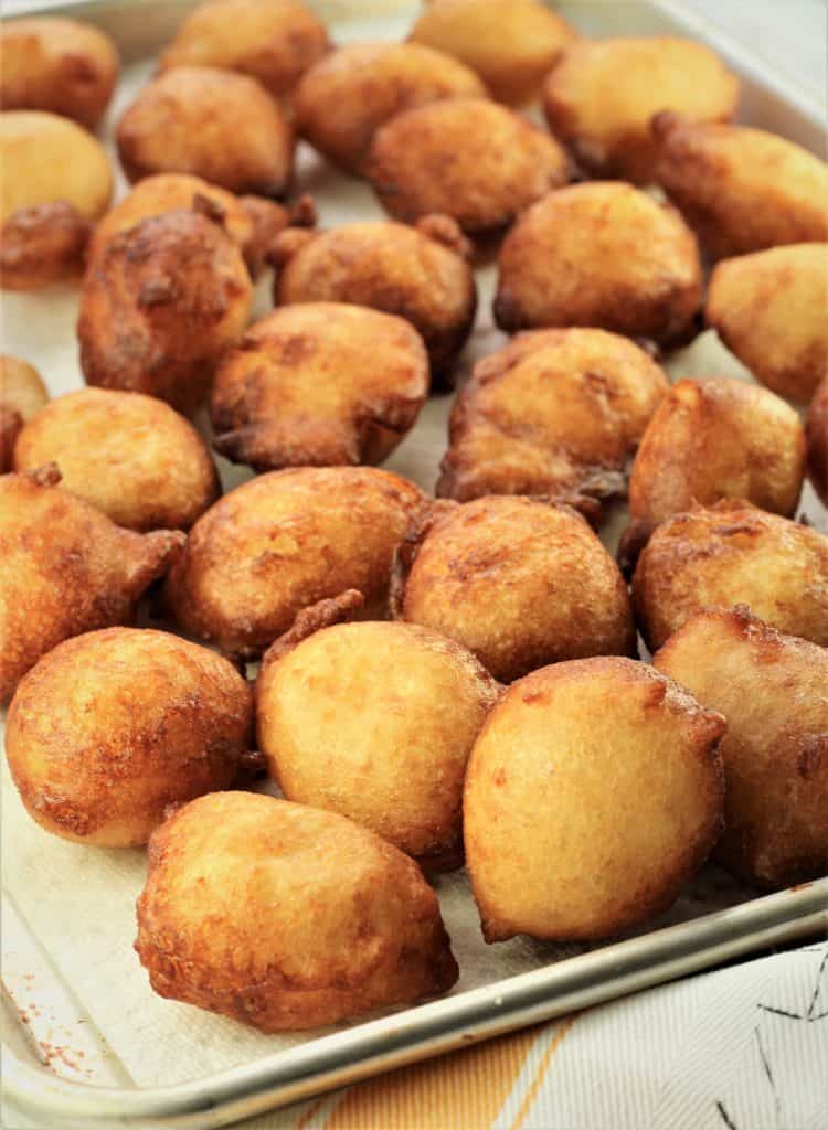 sheet pan covered with just fried potato sfinci