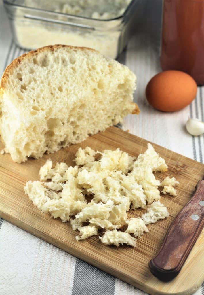 crumb from loaf of bread torn into pieces