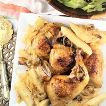 white square plate with roasted chicken legs