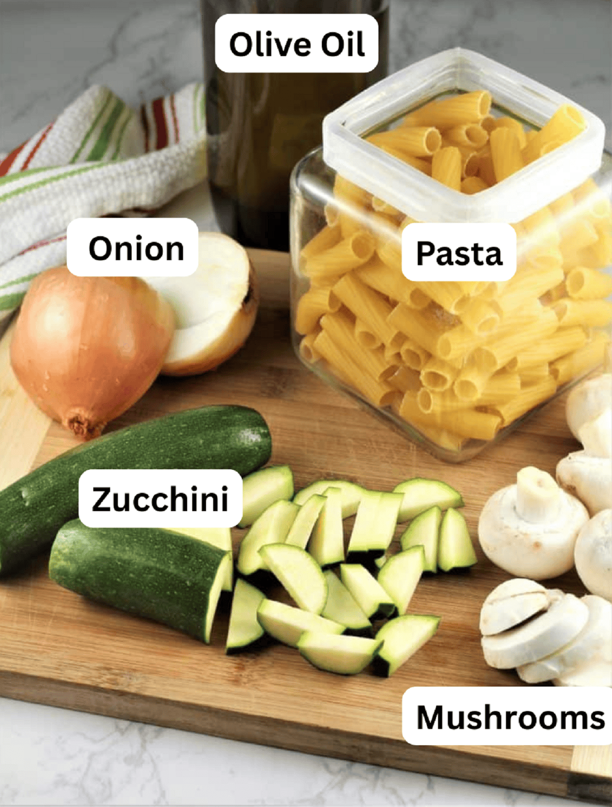 Pasta with Zucchini and Mushrooms Pasta, zucchini, mushromms, onion and olive oil.