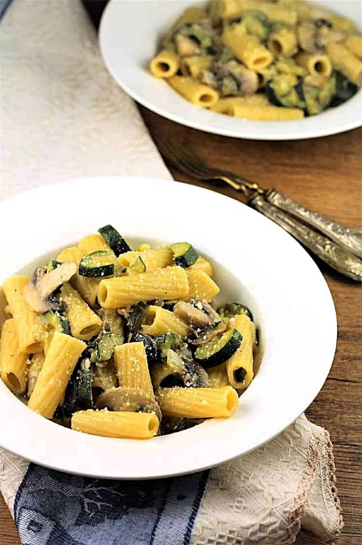 Pasta with Zucchini and Mushrooms Zucchini mushroom pasta in bowl next to second bowl of pasta.