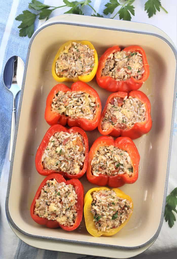 stuffed pepper halves on baking dish