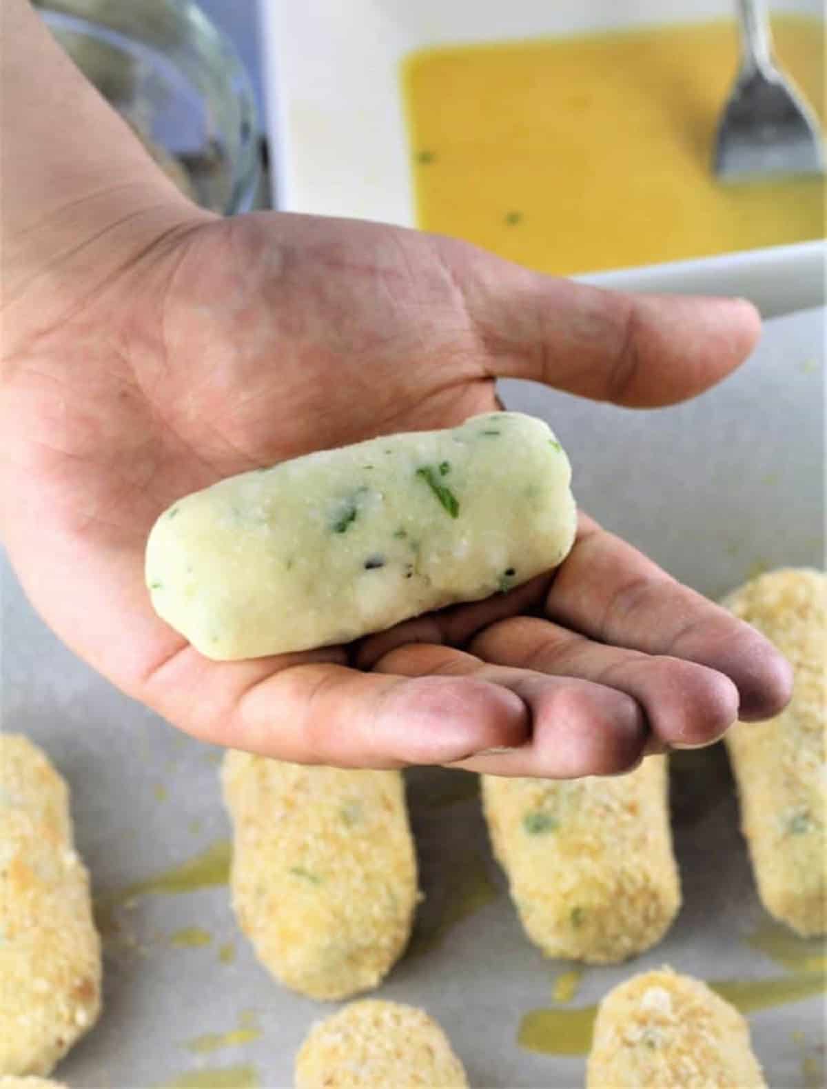 How to shape potato croquettes into sphere with hands.