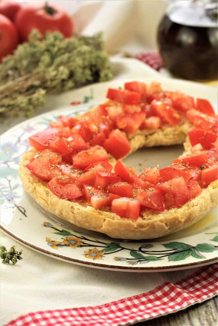 hard bread or pani duru topped with tomatoes, olive oil and oregano