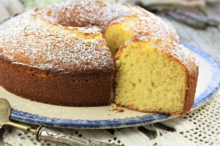 wedge of orange ciambella cut form whole cake