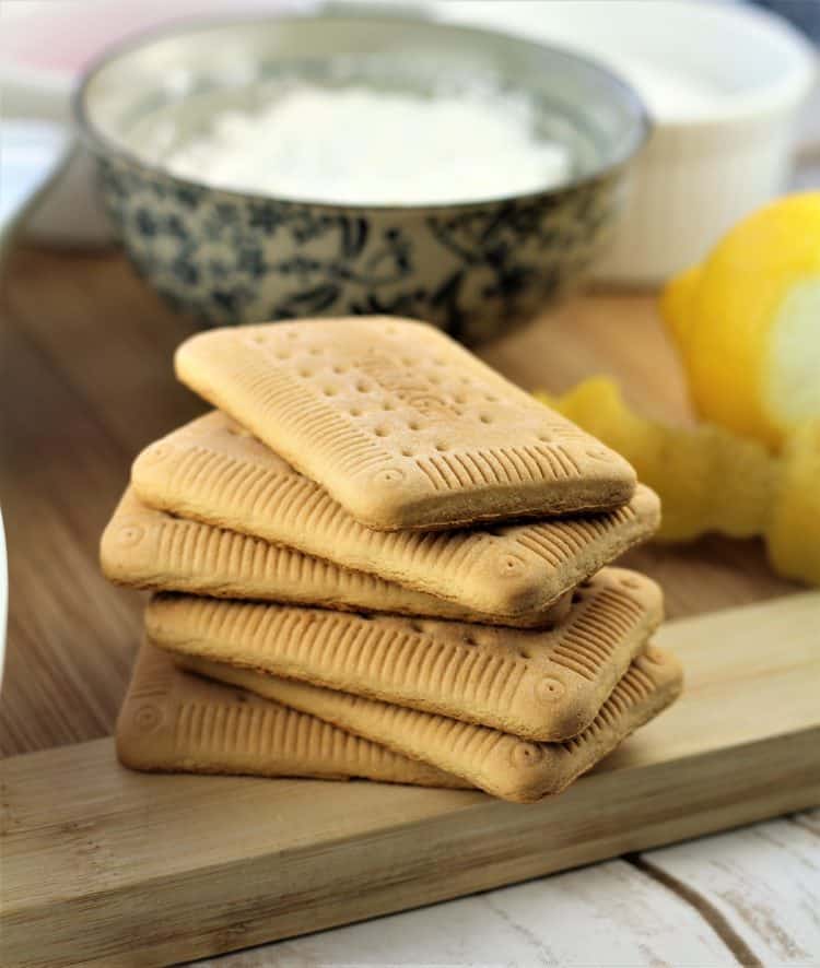 Zuppa Inglese (Crema) piled tea cookies on wood board