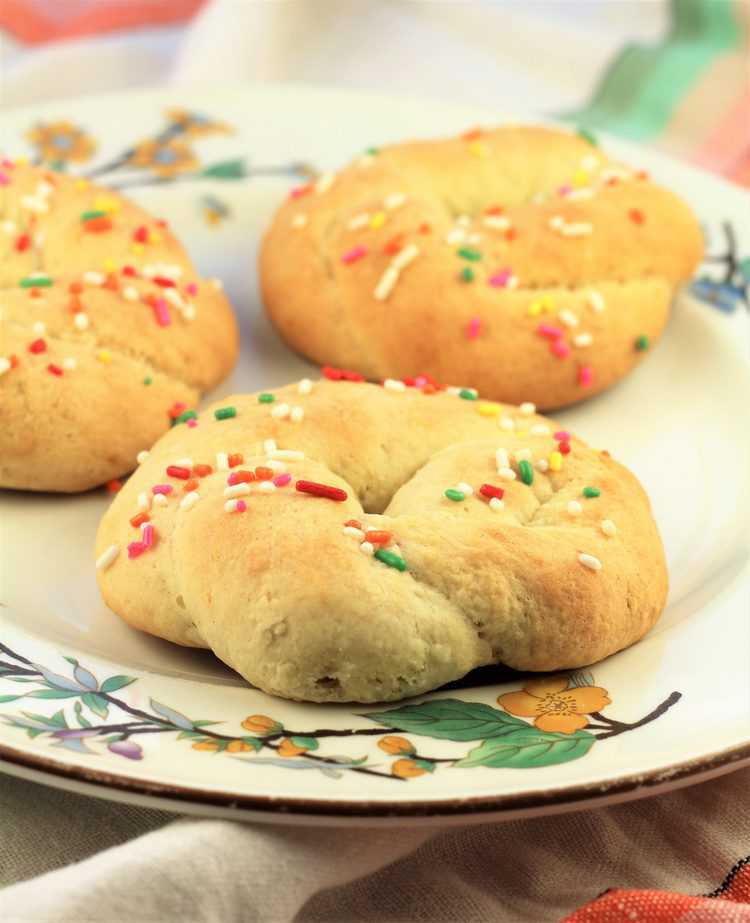 plate with 3 colored candy sprinkle coated cookies