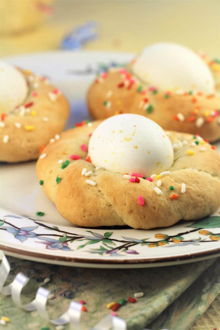 Easter cookie with sprinkles and egg in center on plate